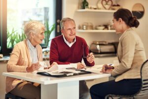 Older Americans Discussing Their Loans Options with a Reverse Mortgage Lender